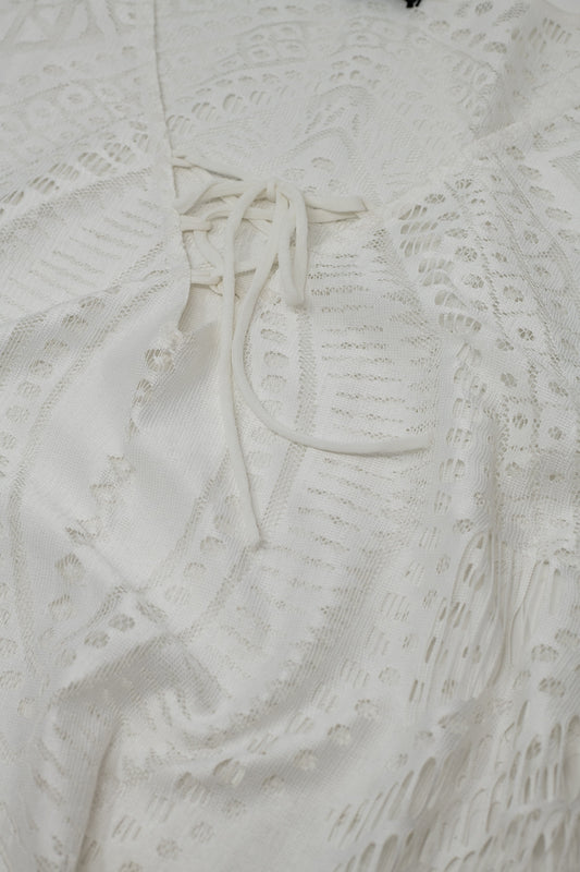 White lace top with fringed hem