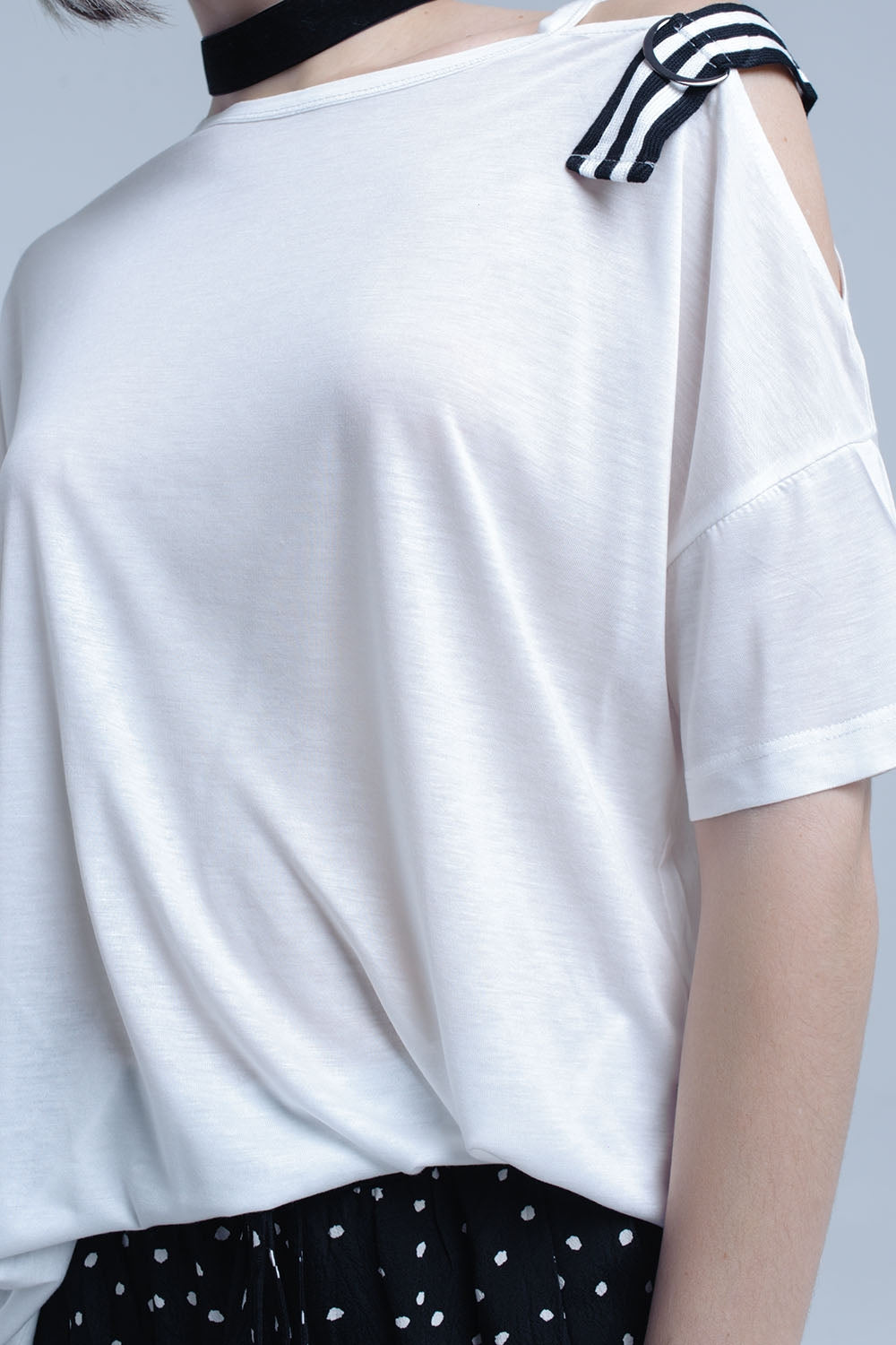 White t-shirt with one open shoulder