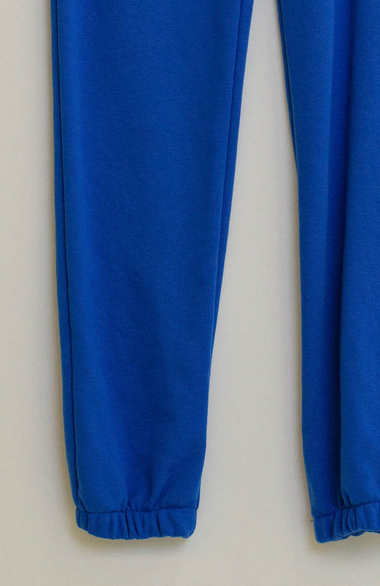 Blue jogger with knotted elastic waist and side pockets